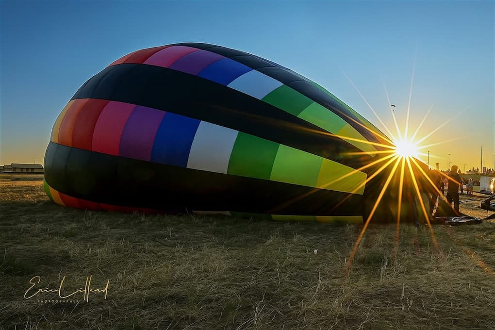 Erie Festival hot air balloon inflating at siunrise.